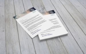 Printed letterhead on a wooden background